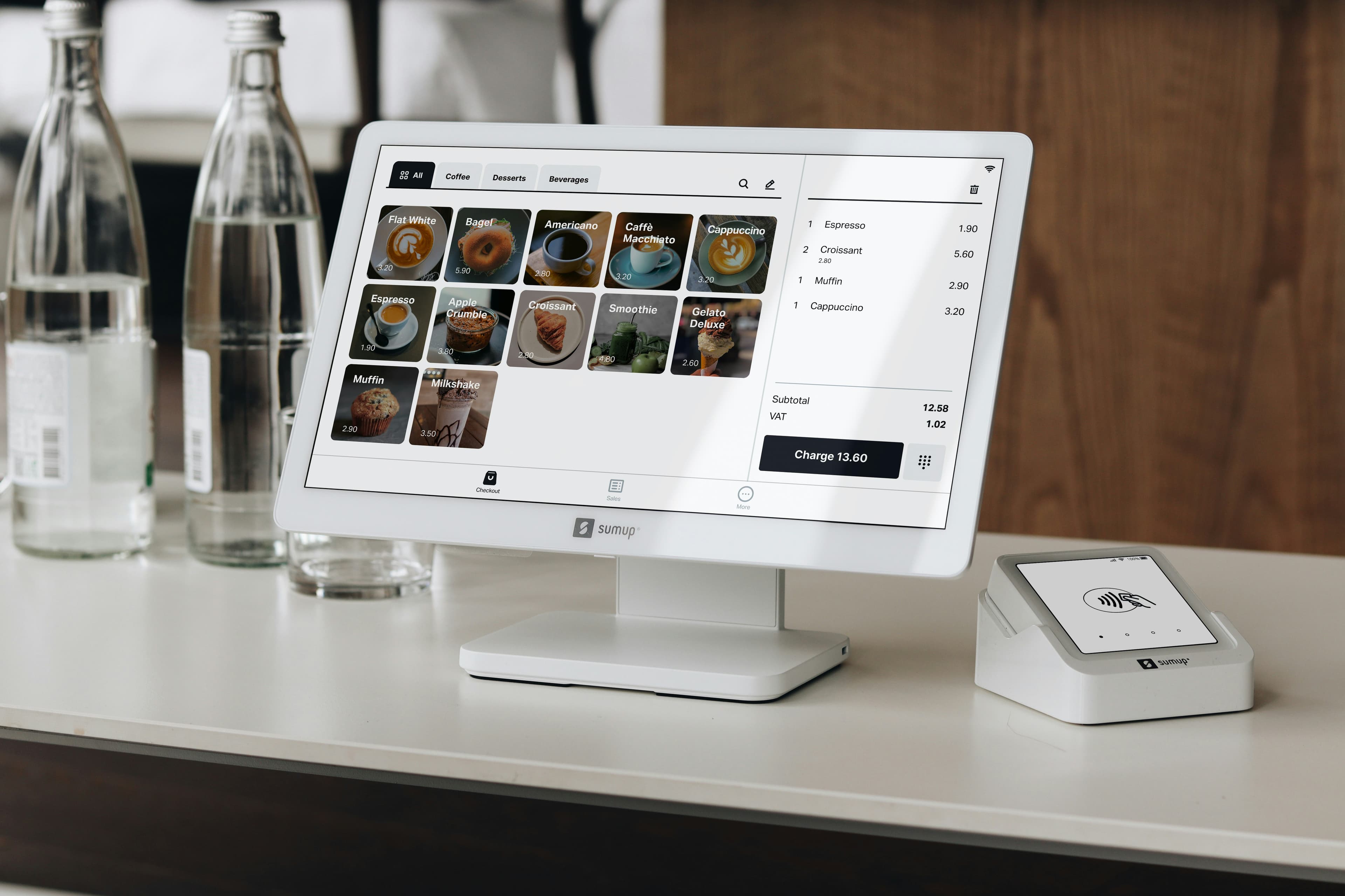 A point-of-sale system set up at a café counter